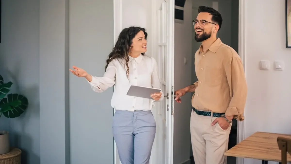 Real estate agent showing modern apartment to client