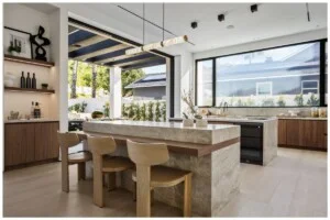 Professionally photographed kitchen view with a big window
